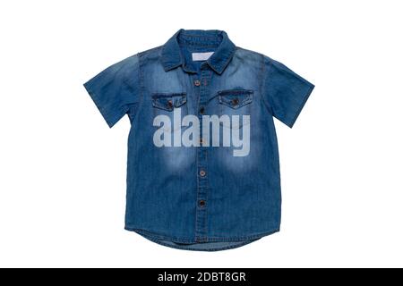 Denim shirts isolated. Close-up of a male stylish faded blue jeans shirt for kids isolated on a white background. Short sleeve shirt summer fashion. Stock Photo