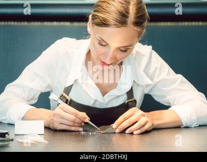 Jeweler sorting diamonds with pincers Stock Photo