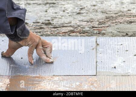 Mason was repaired for the floor tiles Stock Photo