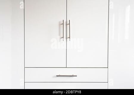 White luxury cupboard doors modern design, closet doors retro background texture abstract new interior closeup Stock Photo