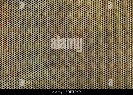 Old, rusted and weathered perforated plate Stock Photo