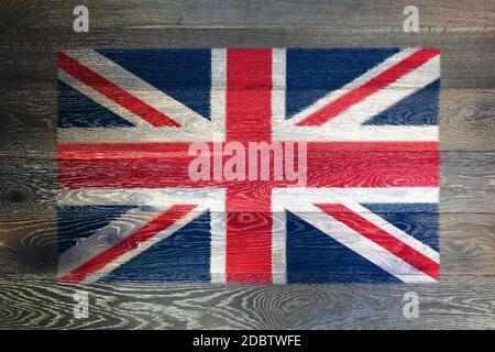 A United Kingdon of Great Britain flag on rustic old wood surface background union jack Stock Photo