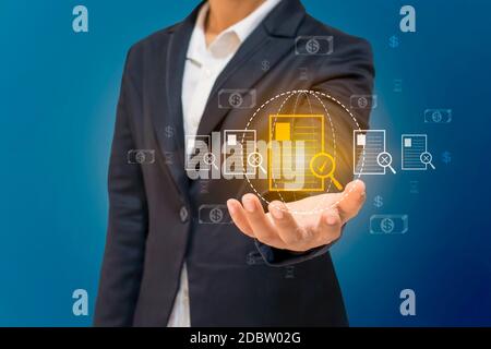 The hands of business people are choosing the right document icon, the concept of the best document management system and financial security. Stock Photo
