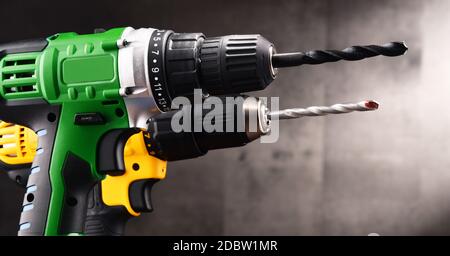 Two cordless drills with drill bits working also as screw guns. Stock Photo