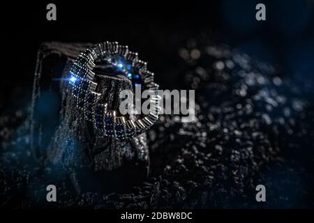 Ring of the jewelry with blue stones on dark background Stock Photo