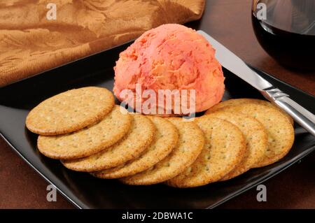 A Port wine and cheddar cheese ball with crackers Stock Photo