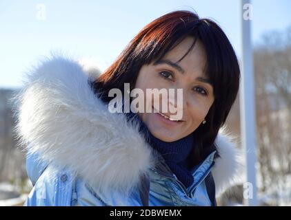 Forty five year old Russian woman sincerely, naturally and kindly smiling, looking at the camera Stock Photo