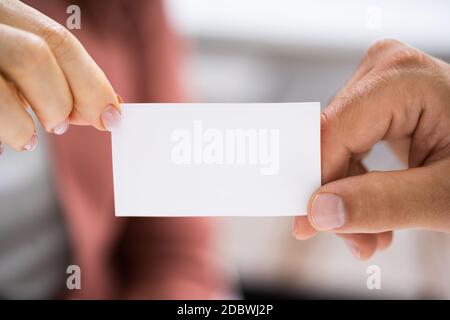 Business Card Exchange. Holding Visiting Or Reference Card Stock Photo