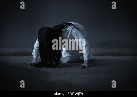 Horror woman ghost creepy crawling, halloween day concept Stock Photo