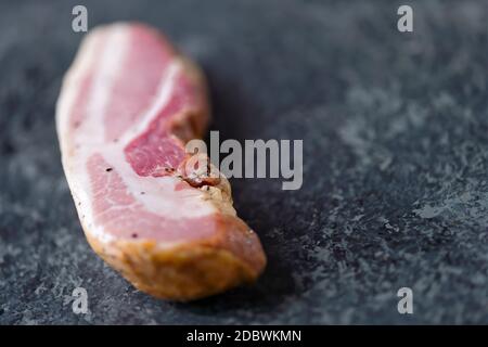 https://l450v.alamy.com/450v/2dbwkmn/close-up-of-rustic-raw-uncooked-italian-bacon-pancetta-bring-home-the-bacon-concept-2dbwkmn.jpg