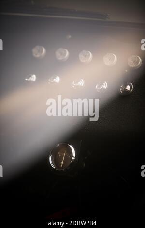 Close up shot of an ampere meter on a vintage car dashboard. Stock Photo
