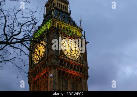 Detail of clock on Big Ben in London, United Kingdom illuminated by lights in evening Stock Photo