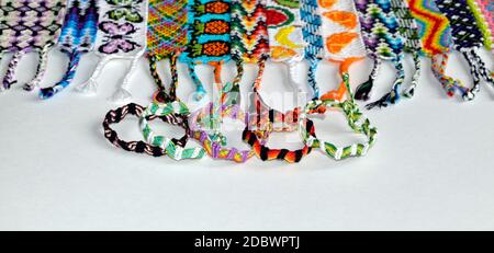 Two woven DIY friendship bracelets with alpha patterns Space Stock Photo -  Alamy