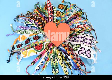 Two woven DIY friendship bracelets with alpha patterns Space Stock Photo -  Alamy