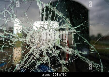 destroyed glass of the window pane of a railway wagon Stock Photo