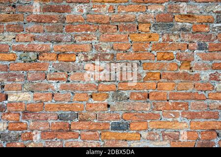 Background from an rough old red brick wall Stock Photo