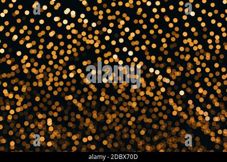 Many lightbulbs hanging on cable as garland decorative in festival isolated on dark night sky background, beautiful design of light string Stock Photo