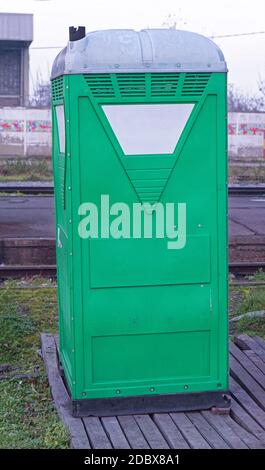 Temporary portable green toilet cabin Stock Photo