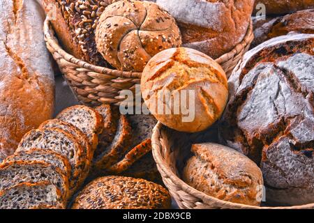 Composition with assorted bakery products in wicker basket Stock Photo