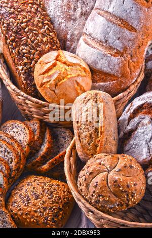 Composition with assorted bakery products in wicker basket Stock Photo