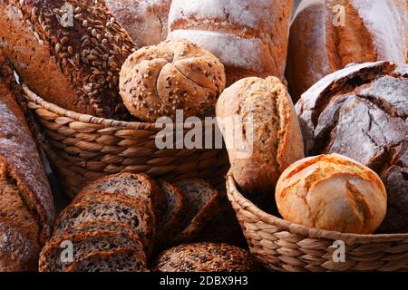 Composition with assorted bakery products in wicker basket Stock Photo