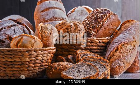 Composition with assorted bakery products in wicker basket Stock Photo