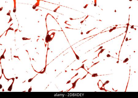 A closeup view of some fresh wet blood spatter over a white background. Stock Photo