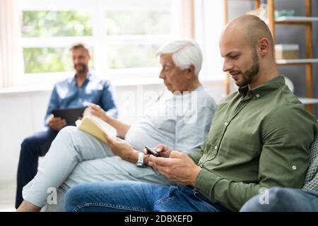 Three Generation Men Spending Time Together At Home Stock Photo