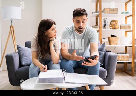 Family In Financial Trouble Having Stress Over Debt And Money Stock Photo