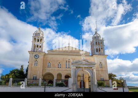 The cristian church of Agia Triada in the traditional village  lefkes Paros island, Greece a beautiful day with clouds. Stock Photo
