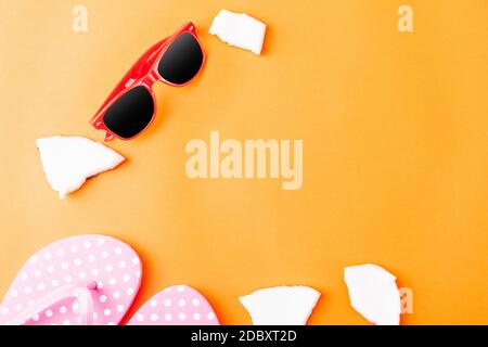 Happy coconuts day concept, fresh coconut, Sunglasses and Slippers, studio shot isolated on an orange background, Beach tropical fruit trip journey an Stock Photo