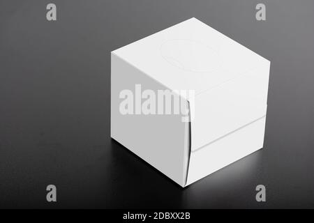 Cubical tissue box on black background, editable mock-up series ready for your design, selection path included. Stock Photo