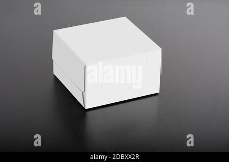 Cubical tissue box on black background, editable mock-up series ready for your design, selection path included. Stock Photo