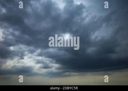 Dark clouds in the dramatic sky Stock Photo