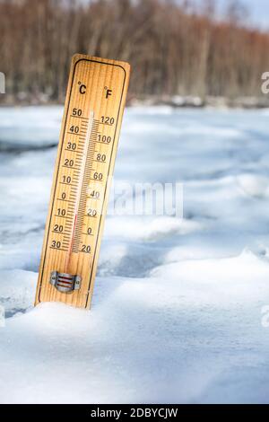 Thermometer shown outside with low temperature Stock Photo - Alamy