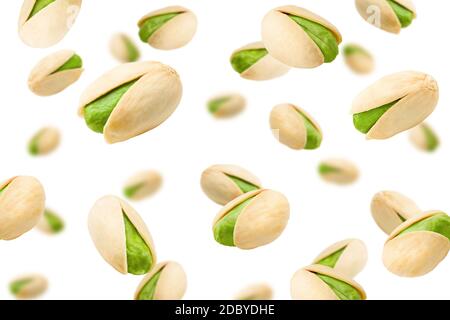 Falling pistachio isolated on white background, selective focus Stock Photo