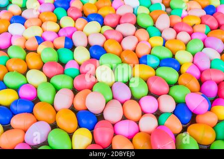 The Colorful easter eggs,Colorful plastic eggs toys floating on the water background Stock Photo