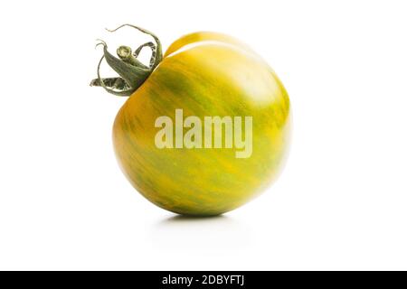 Green zebra tomato isolated on white background. Stock Photo