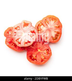 Sliced red beefsteak tomatoes isolated on white backround. Stock Photo