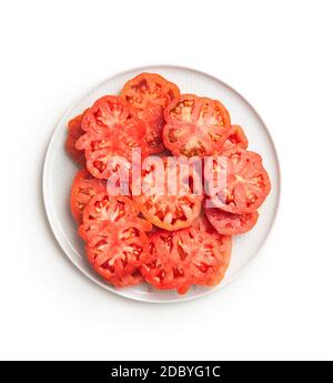 Sliced red beefsteak tomatoes isolated on white backround. Stock Photo