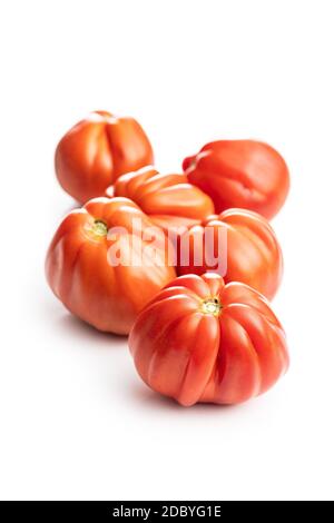 Red beefsteak tomatoes isolated on white backround. Stock Photo