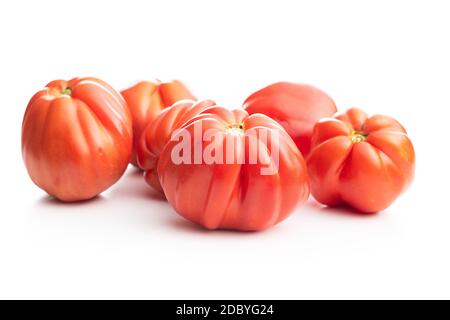 Red beefsteak tomatoes isolated on white backround. Stock Photo