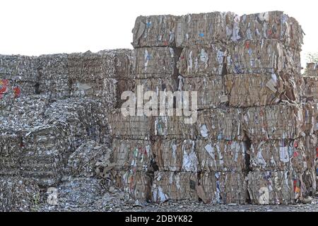 Paper and carboard carton material stacked for recycling Stock Photo