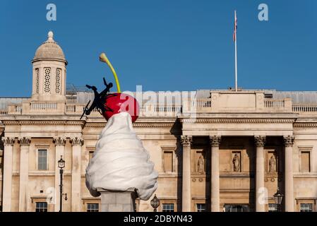 The End. A dollop of whipped cream with an assortment of toppings: a cherry, a fly, and a drone. Fourth plinth art by Heather Phillipson in Trafalgar Stock Photo