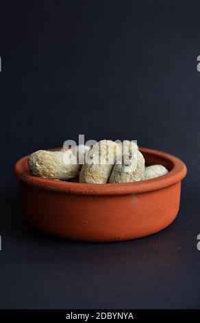 Shelled peanuts salted in clay pot Stock Photo