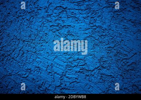 The wall is made of plaster with scratches. Rough surface. abstract blue background. A template for the design of a website or ad. Stock Photo