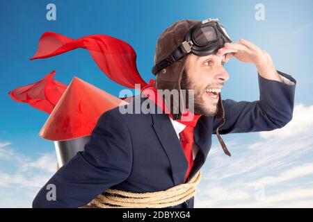 Businessman with homemade rocket and googles ready for a challenge Stock Photo