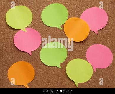 colorful paper stickers glued on brownboard, idea and multitasking, close up Stock Photo