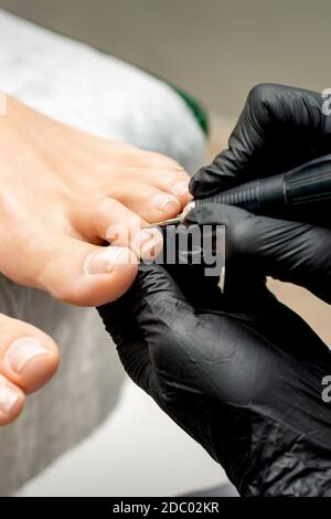 Professional pedicure using dieffenbach scalpel.Patient visiting  podiatrist.Medical pedicure procedure using special instrument with blade  knife holde Stock Photo - Alamy