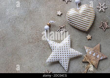 Eco-friendly Christmas decorations and toys made from fabric and wood on concrete background. Zero waste holiday concept. Christmas or New Year Stock Photo